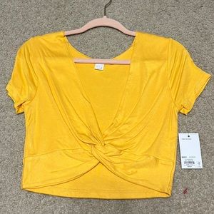 Bright yellow tied crop top. Size medium.
